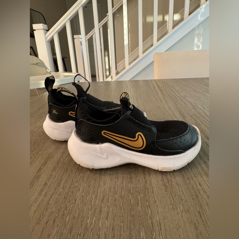 Nike Toddler Black and Gold Slip-On Sneakers
